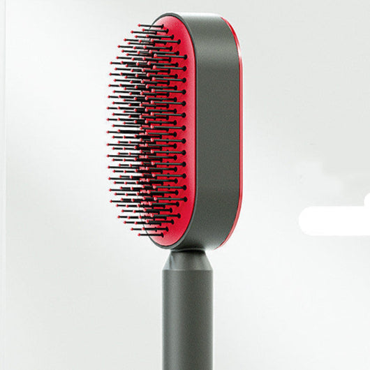 Red and gray hair removal brush on a white background